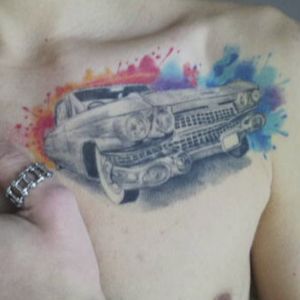 Classic Cadillac with a watercolor background set on the chest