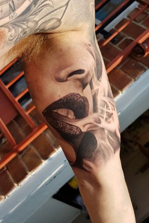 Black and grey, realism, realistic lips smoke and that's all for tags I can think of. Nose. Bricks. 