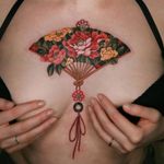 Floral fan tattoo by Sion #Sion #TattoodoApp #TattoodoApptattooartist #tattooartist #tattooart #tattooidea #inspiringtattoo #besttattoo #awesometattoo #peony #flower #fan #norigae #knot #chest #ornamental