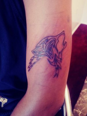 Tribal wolf no fill in. It was her second tattoo.