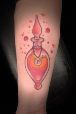 Colorful Vial Tattoo on the Forearm