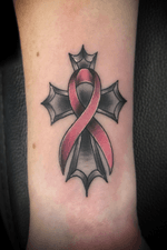 Cancer Ribbon Cross Tattoo on the Forearm