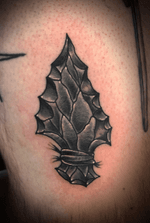Black and Grey Traditional Arrowhead Tattoo on the Thigh