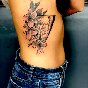 Elephant and flowers on rib cage