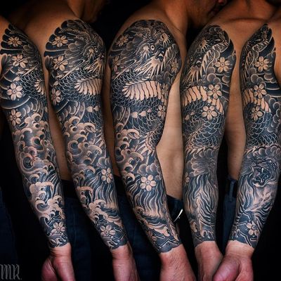 Sleeve tattoo by Mike Rubendall #MikeRubendall #sleevetattoos #legsleeve #armsleeve #sleeve #fullsleeve #halfsleeve #tattooidea #japanese #irezumi #dragon #waves #tiger #cherryblossom #blackandgrey