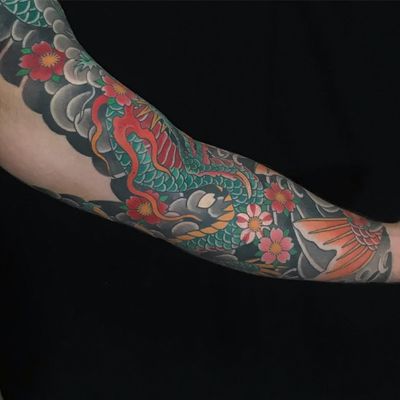 Sleeve tattoo by Chris Garver #ChrisGarver #sleevetattoos #legsleeve #armsleeve #sleeve #fullsleeve #halfsleeve #tattooidea #japanese #irezumi #dragon #koi #cherryblossoms