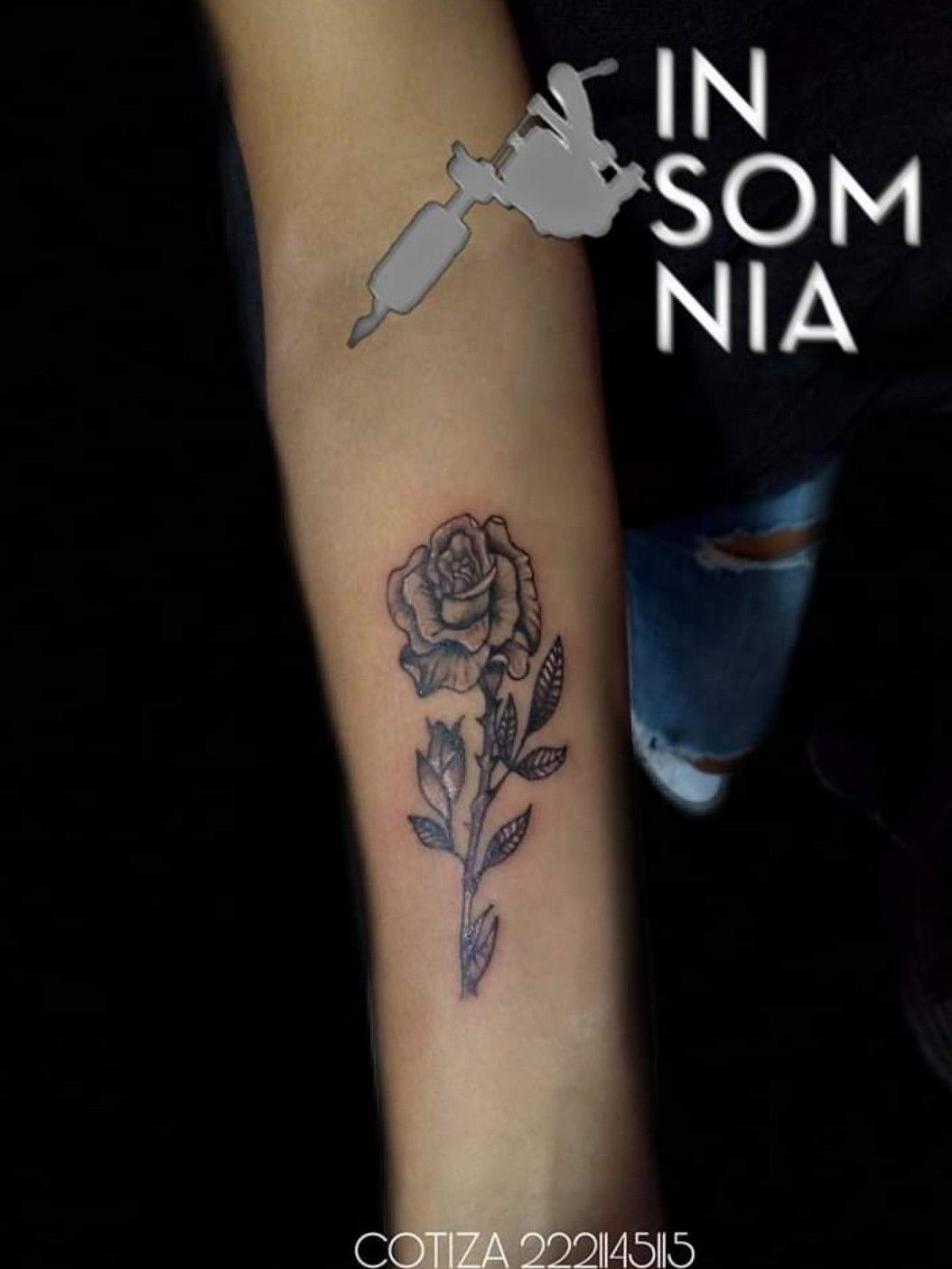 Minimalist butterfly tattoo on the upper arm