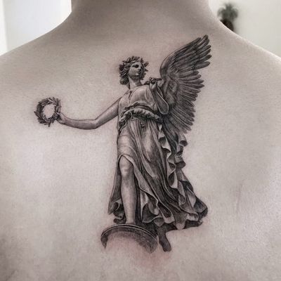 Angel tattoo by Moca Tattoo #MocaTattoo #angeltattoo #angeltattoos #angels #wings #feathers #cherubs #religious #spiritual #back #blackandgrey #realism #realistic