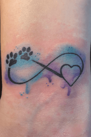 Just a simple, but pleasing water color wrist infinity dog print symbol tattoo. 