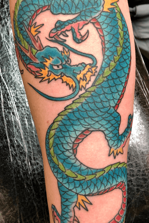 Winding Japanese style dragon on a forearm 