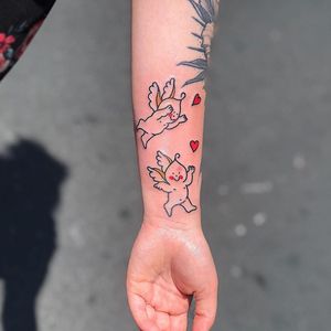 Angel tattoo by Harry Mckenzie #HarryMckenzie #angeltattoo #angeltattoos #angels #wings #feathers #cherubs #religious #spiritual #arm #cartoon #illustrative #newschool #heart #cute