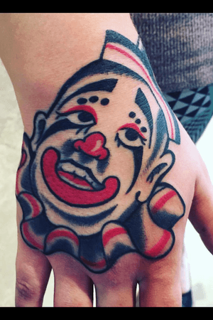 Clown hand tattoo