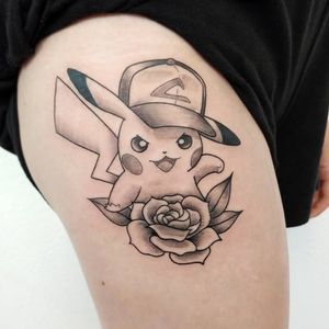 Black and grey Pikachu on upper thigh