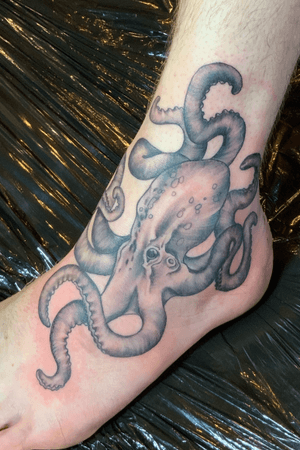 Freehand blackwork octopus on foot
