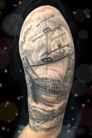 Realistic black and gray sailing ship and ocean 