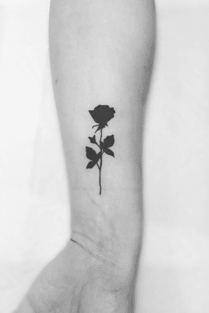 Simple Rose Silhouette Tattoo