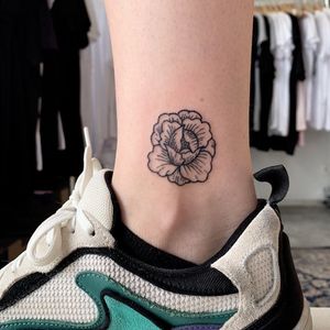 Ankle tattoo by Jix Hanpoke Tattoo #Jixhandpoketattoo #ankletattoo #ankle #leg #smalltattoo #anklet #handpoke #flower #peony #floral #blackwork #linework #dotwork