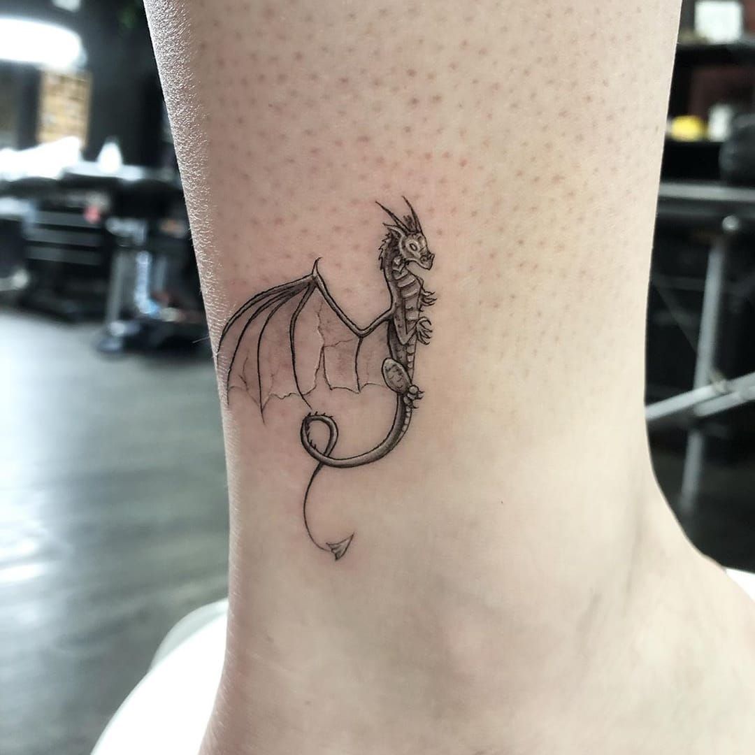 Outline dragon tattoo on the ankle  Tattoogridnet