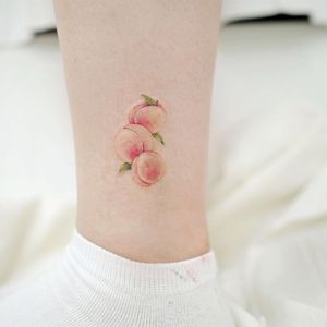 Ankle tattoo by song.e_tattoo #songetattoo #ankletattoo #ankle #leg #smalltattoo #anklet #peaches #fruit #food #cute #color #small #leaves #nature