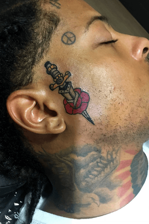 Traditional dagger & rose on Marcus Manchild’s face