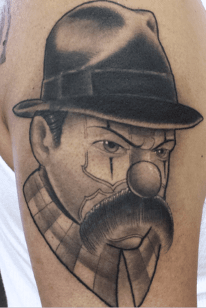 Gangster black n grey chicano style tattoo.