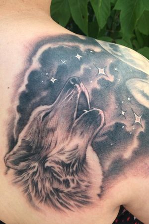Howling Wolf & Star background done by Freddie Brown at Color Theory Tattoo in Lombard, IL