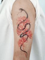 Beautiful tattoo by Bium Tattoo #BiumTattoo #beautifultattoos #beautifultattoo #beautiful #tattooidea #besttattoo #awesometattoo #cooltattoo #illustrative #snake #linework #flower #floral #nature #arm