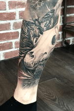 Skull and moth on a leg sleeve 