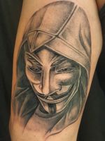Anonymous mask wearing Assassin's creed hoodie. 