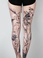 Floral leg sleeve tattoos by Dzo Lama #DzoLama #TattoodoApp #TattoodoApptattooartist #tattooartist #tattooart #tattooidea #inspiringtattoo #besttattoo #awesometattoo #illustrative #bee #floral #flower #leaves #nature #leg