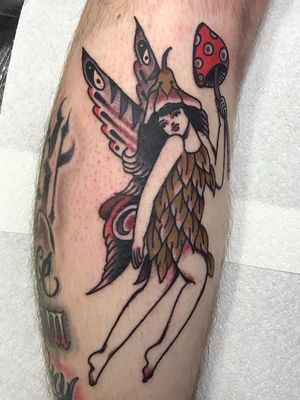 Fairy tattoo by Justin Rockett #JustinRockett #TattoodoApp #TattoodoApptattooartist #tattooartist #tattooart #tattooidea #inspiringtattoo #besttattoo #awesometattoo #traditional #color #fairy #leg #mushroom #flower