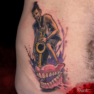 This guy is an dentist, he also in love whith sax, ok, this tattoo will represent this moment for him.