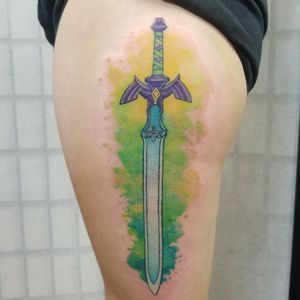 A fun Mastersword with watercolor splash behind it! Nerd tattoos all the way! <3 Please DM me through instagram or facebook for bookings @classylasslilith #mastersword #zeldatattoo #swordtattoo #watercolortattoo #videogametattoos #nerdtattoo #zeldatat #colortattoo 