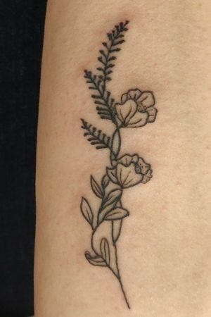 Delicate little flower tattoo, back of the arm.