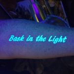 UV Ink Tattoo by Tamara Barnes #TamaraBarnes #uvinktattoo #uvink #uvtattoo #ultraviolet #ultraviolettattoo #uv #arm #lettering #light #quote