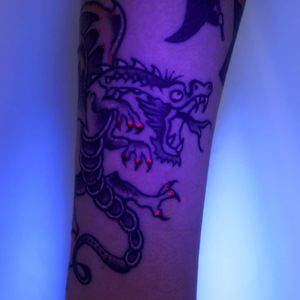 UV Ink Tattoo by Kendra Gruis aka deadfoxtattoo #KendraGruis #Deadfoxtattoo #uvinktattoo #uvink #uvtattoo #ultraviolet #ultraviolettattoo #uv #dragon #Japanese #illustrative #forearm #arm