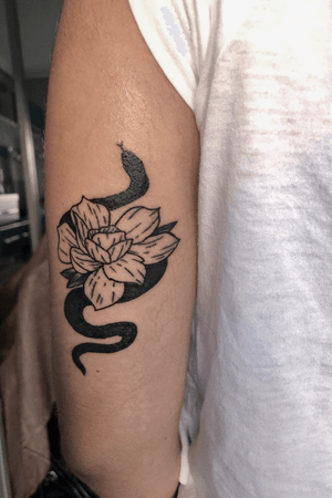 Tattoo inspired by client’s design #blackwork #snake #flower