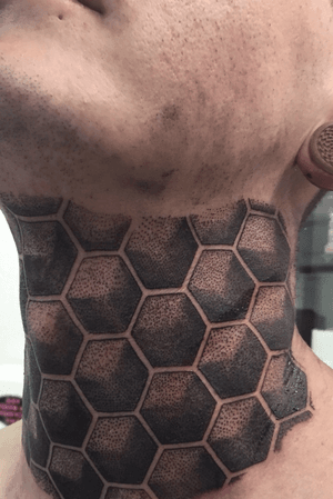 First sitting of geometrical dot work on the throat and around the neck 