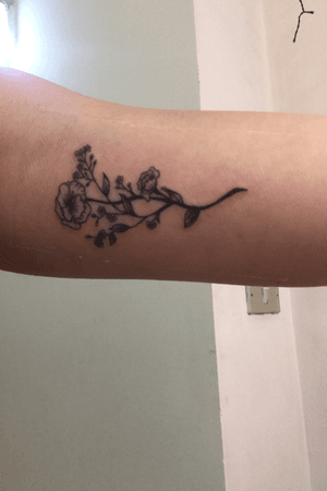 My first tattoo! It was still fresh when i took this picture. Just a simple flower inside of my bicep.        #flower #small #blackandgrey 