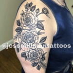 Blackwork roses on the upper arm