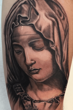 Virgin mary. La Pieta on forearm