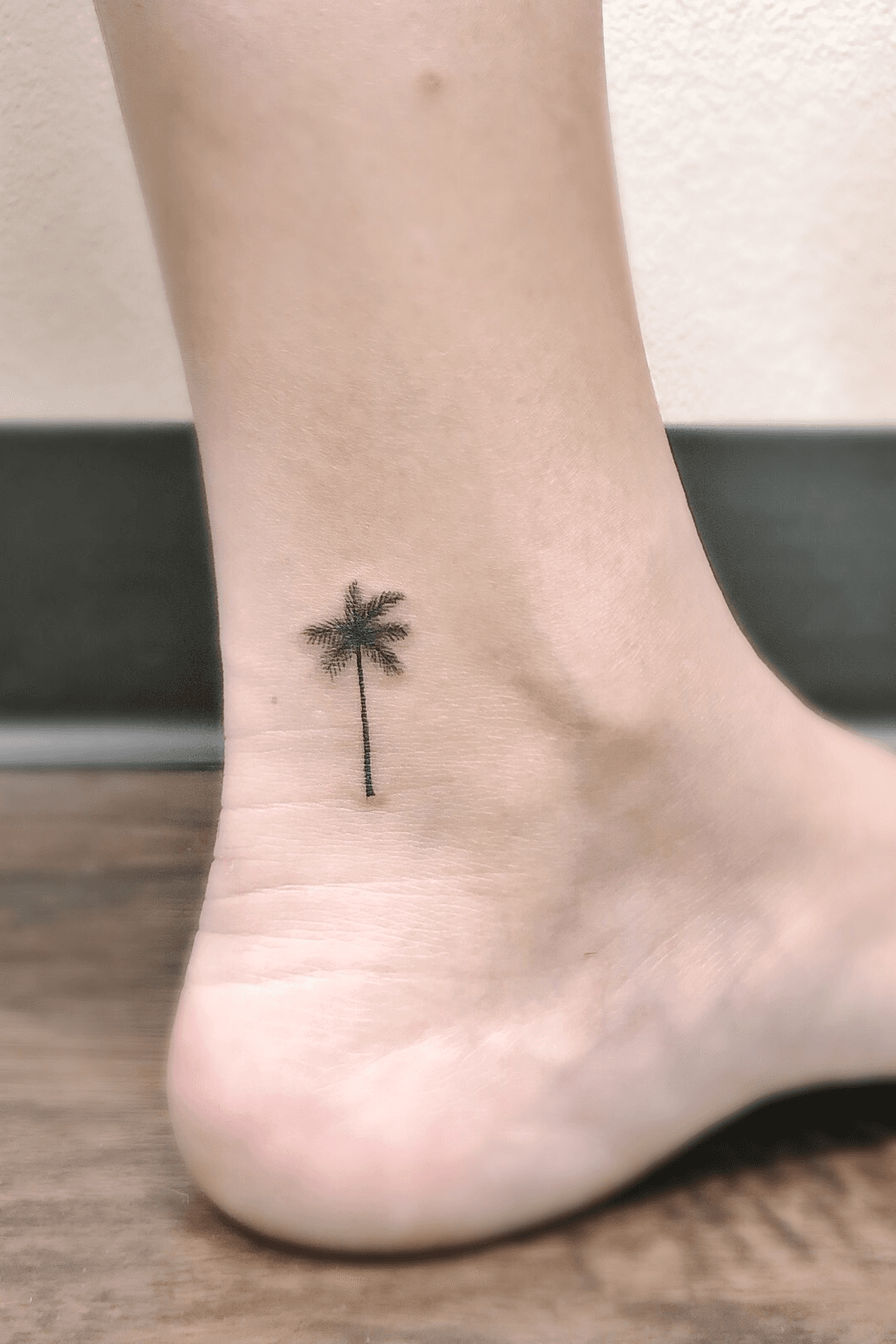Palm tree tattoo on the ankle