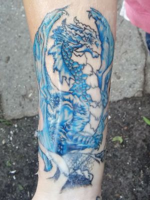 This is a cover up that I really like it took some time to do because we had to find the right size and type of dragon to put here but it came out great.