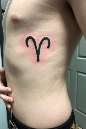 Aries zodiac rib tattoo