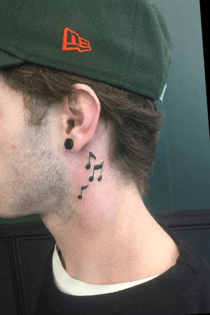 Little music notes behind the ear. 