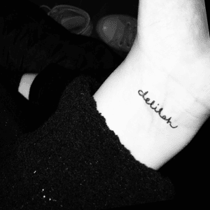 tiny name tattoo on wrist; delilah