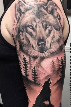 Black and grey wolf tattoo