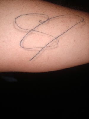 My husband's signature w a heart an infinity symbol
