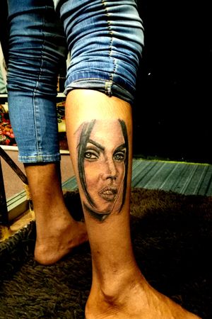 Girl Face portrait on leg