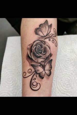 Black and grey realism rose and butterflies. 